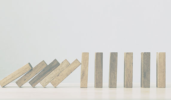 a sequence of blocks falling over like dominoes