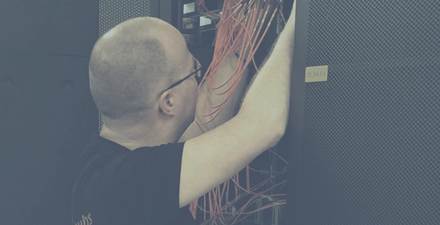 Photo of a technician in a data centre